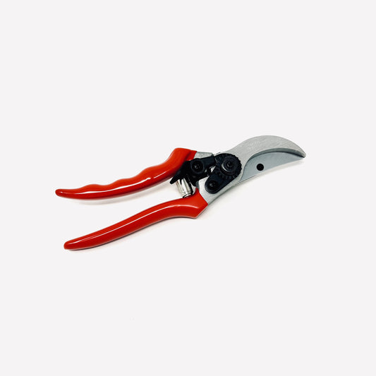 Red-handled pruning shears on a white background