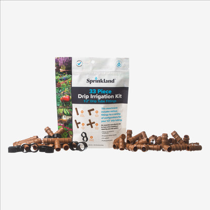 A 33 piece drip irrigation kit packaging with 1/2" fittings visible on the front, labeled for 1/2 inch drip tubing, with a green garden and plants in the background.