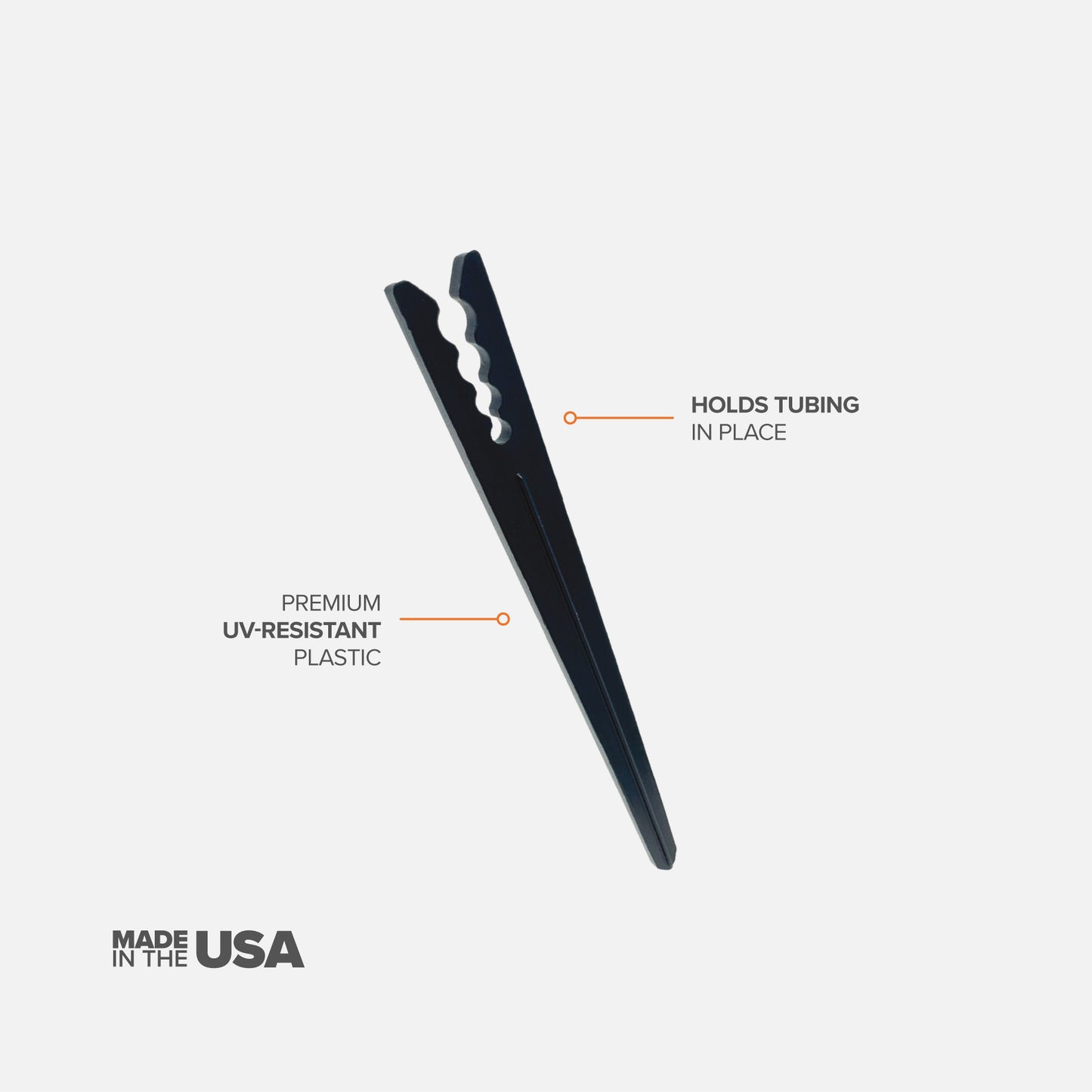 A single black 6" drip tubing plastic support stake designed to hold tubing in place with features described on a white background. 