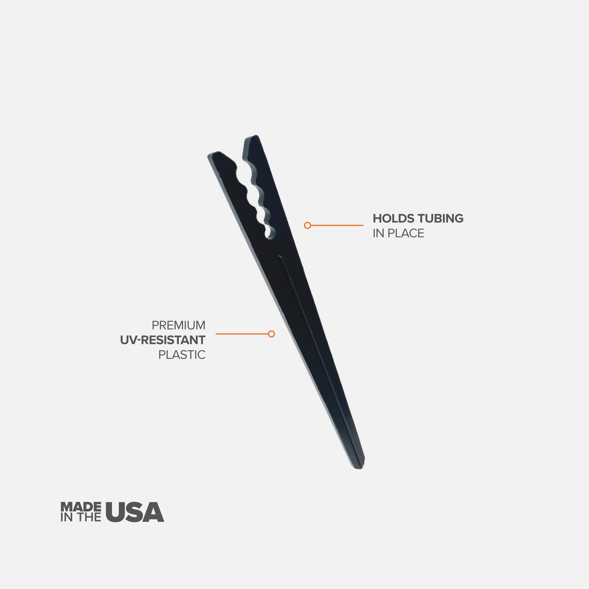 A single black 6" drip tubing plastic support stake designed to hold tubing in place with features described on a white background. 