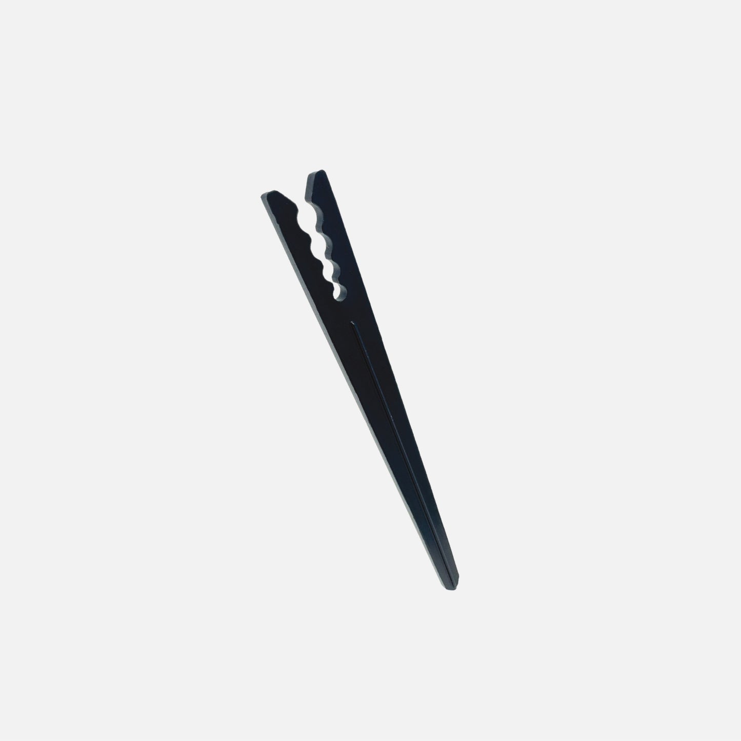 A single black 6" drip tubing plastic support stake designed to hold tubing in place.