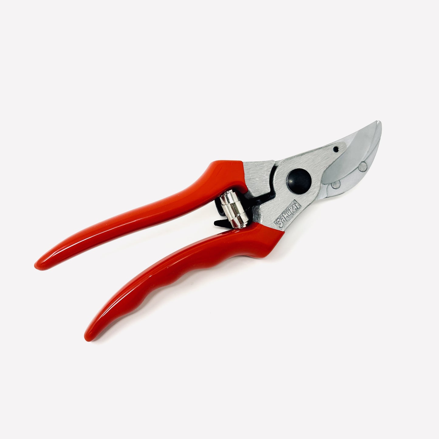Red pruning shears on a white background