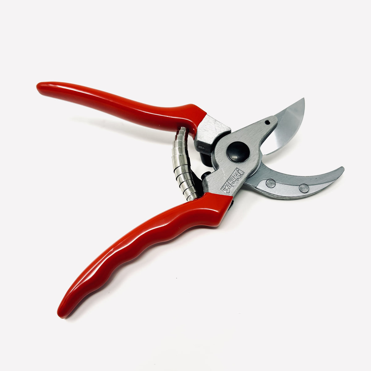 Gardening shears with red handles on a white background